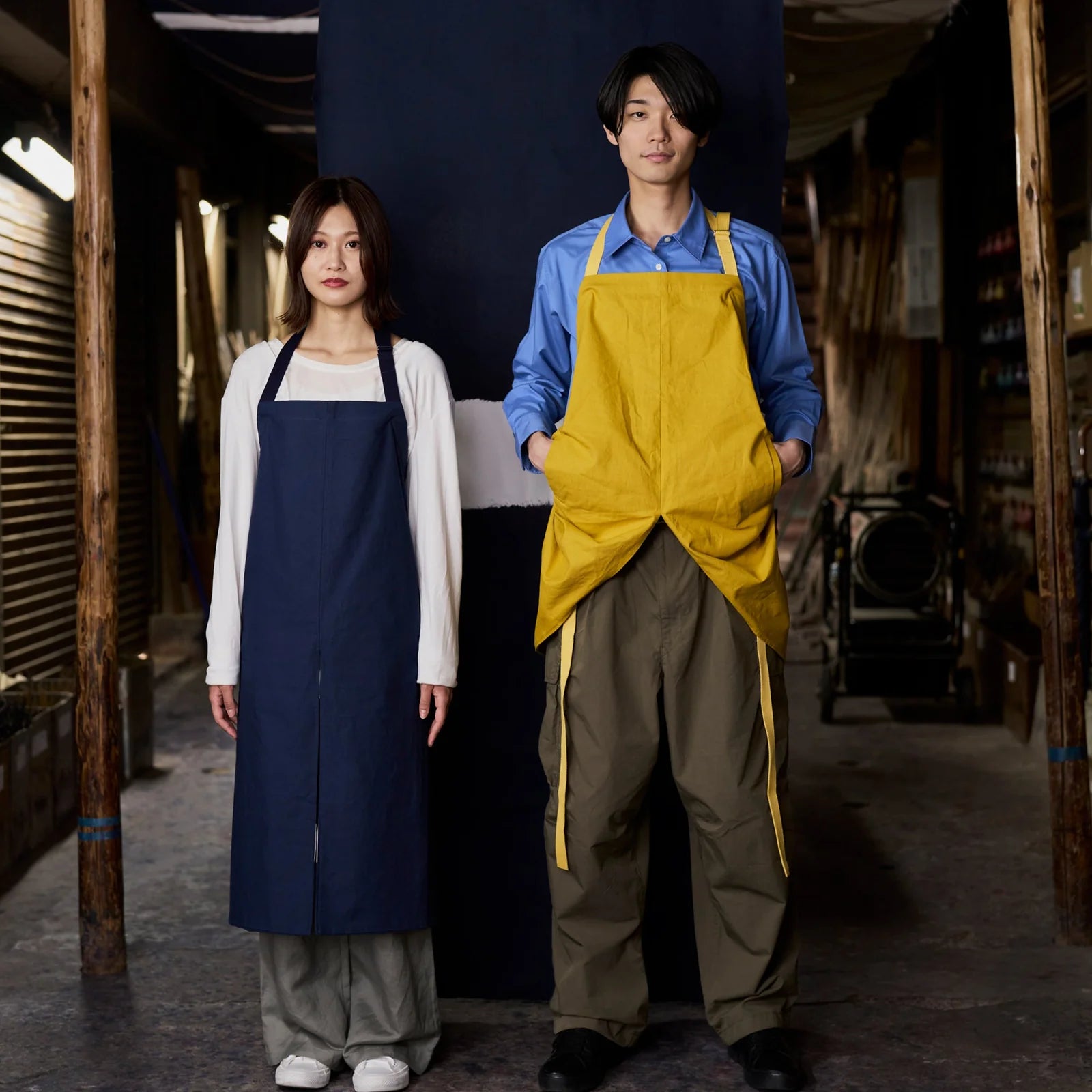 MAKU Japanese cotton apron in Indigo Blue and Mustard - worn by two models