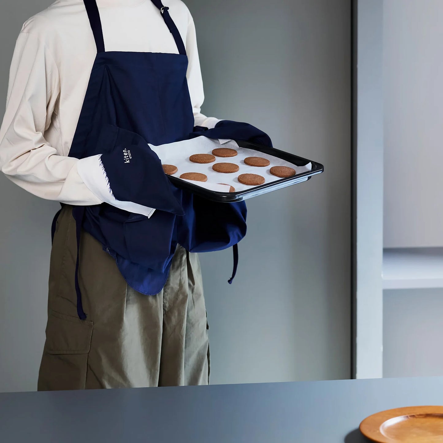 MAKU Japanese cotton apron in Indigo Blue - kitchen baking scene